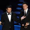 Composers Atticus Ross (R) and Trent Reznor, winners of the award for Best Original Score for 'The Social Network' accept their award on stage at the 83rd Annual Academy Awards