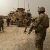 US soldiers keep watch at the entrance of a military base following the shooting of Afghan civilians allegedly committed by a rogue US soldier in Kandahar province on March 11, 2012.