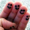 Happy faces on fingertips