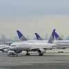 This November 24, 2009 photo shows Continental Airlines jets on the tarmac at Liberty International Airport in Newark, New Jersey. THe New York City skyline is in the background.