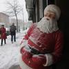 A Santa figurine receives a coating of snow in Brooklyn Sunday as a post-Christmas storm sweeps through the area.