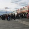 The crowd of protesters spills outside Ruby's Bar on the Coney Island boardwalk