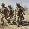 U.S. Marines carry a wounded enemy prisoner of war (EPW) to a MEDEVAC helicopter September 21, 2010 near Marja, Afghanistan. 