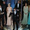 Winner for Best Director for 'The Artist' Michel Hazanavicius speaks onstage flanked by the cast of the Artist as he accepts the trophy for Best Movie at the 84th Annual Academy Awards.