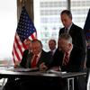 Mayor Michael Bloomberg, Larry Silverstein (L) and William Perlstein (R) signing a lease for William Hale