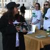 Jen Browne and Claire Burke give out free books in the Bronx for St. Patrick's Day.