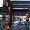 Workers at the Deutsche Bank dismantling steel beams