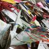 Paper cranes made of subway maps, grocery store flyers and other materials made by studens in Jackson Heights, Queens.