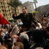 An Egyptian Army officer sympathizing with marchers is carried during an anti-government protest in Tahrir Square January 30, 2011 in Cairo, Egypt.