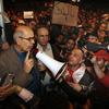 Opposition leader Mohamed ElBaradei waves to supporters in Tahrir Square on January 30, 2011 in Cairo, Egypt.