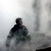 This US Navy photo released 17 September, 2001, shows a firefighter emerging from the smoke and debris of the World Trade Center September 14, 2001.