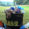 An overflowing garbage can in Brooklyn's Prospect Park