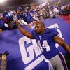 Ahmad Bradshaw #44 of the New York Giants celebrates as he runs off of the field after defeating the Dallas Cowboys at MetLife Stadium on January 1, 2012