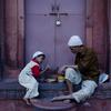 An Indian Muslim man and child break their fast on the first day of Ramadan at Jama Masjid mosque in New Delhi on August 12, 2010.