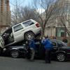 A jeep mounts a car in Midtown on March 4, 2011