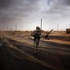 A Libyan rebel fighter mans a check point in the stronghold oil town of Ras Lanuf on March 5, 2011 where up to 10 people were killed and more than 20 wounded.