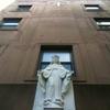 The doorway of a convent in Park Slope, Brooklyn, crowned by a statue.