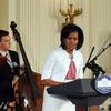 First Lady Michelle Obama speaks during a jazz music workshop at the East Room of the White House on June 15, 2009.