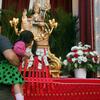 Visitors leave money for charity at the statue of San Gennara at the Most Precious Blood Church on Mulberry Street in Little Italy.