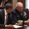 US President Barack Obama (L) talks to retired Coast Guard Admiral Thad Allen, National Incident Commander, during a meeting with cabinet members to discuss the administration's response to oil spill.
