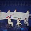 The Paralympic Flag is carried to be raised during the opening ceremony of the London 2012 Paralympic Games.