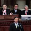 New York Gov. David Paterson speaks after being sworn in as  Assembly Speaker Sheldon Silver (L), Attorney General Andrew Cuomo (center) and Joseph Bruno listen on March 17, 2008.
