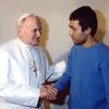 Pope John Paul II greets Mehmet Ali Agca at Rome's Rebibbia prison on December 27, 1983.