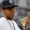 Rapper Jay-Z watches the game between the New York Yankees and the Kansas City Royals on July 23, 2010 at Yankee Stadium