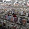 Record store filled to the brim; people shopping