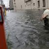 David Lutz of Red Hook wades through water over two feet deep as he enters the Brooklyn Cruise Terminal in the aftermath of Hurricane Irene on August 28, 2011 in the Brooklyn borough of New York City.