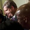 Secretary of Agriculture Tom Vilsack listens as members of the Congressional Black Caucus speak to the press after a meeting on Capitol Hill to discus the forced resignation of Shirley Sherrod.