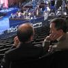 Brian Lehrer and Dennis Kucinich speak together overlooking the convention floor at the Pepsi Center in Denver