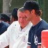 New York Yankees owner George Stienbrenner (C) talks with Don Mattingly (R) in 1995