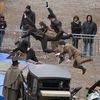 Stuntmen train on the set prior to the shooting of a scene of the 'Sherlock Holmes 2' movie, in front of the cathedral of the French eastern city of Strabourg, on February 3, 2011