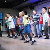 Seven year old Coleman Williams (center) rehearses his tap dance moves.
