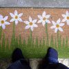 welcome mat with daisies