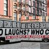 An 18-wheeler truck wrapped in bold black, white and red messages by the visual artist Barbara Kruger that's part of 'America: Here and Now'