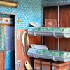 A detail view of Mar Cerdà's paper diorama illustrating an interior from 'The Darjeeling Limited'