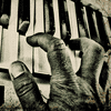 Hand playing the piano