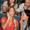 Audiences shush a woman taking a call at a concert