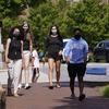 Students wear masks on campus at the University of North Carolina in Chapel Hill, N.C., Tuesday, Aug. 18, 2020. 