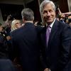  Jamie Dimon, chairman of the board, president and CEO of JPMorgan Chase, arrives to testify at a Senate Banking, Housing and Urban Affairs Committee hearing, 2012.