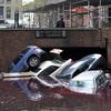 Cars piled on top of each other at the entrance to a garage on South Willliam Street in Lower Manhattan October 31, 2012 in New York as the city begins to clean up after Hurricane Sandy.