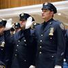 Officers practice taking their oaths prior to an NYPD promotion ceremony at One Police Plaza. 
