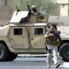  A picture taken on July 5, 2005 shows contractors of the US private security firm Blackwater securing the site of a roadside bomb attack near the Iranian embassy in central Baghdad. 