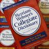 The eleventh edition of Merriam-Webster's Collegiate Dictionary is seen stacked on other dictionaries at the company's headquarters in Springfield, Mass., Tuesday, July 3, 2007.