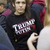 A woman wears a shirt reading 'Trump Putin '16' while waiting for Republican presidential candidate Donald Trump to speak at a campaign event at Plymouth State, N.H.
