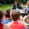 President Barack Obama and first lady Michelle Obama act out monsters as they read 'Where the Wild Things Are,' to children at the White House Easter Egg Roll on the South lawn at the White House.