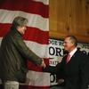 Steve Bannon, left, introduces U.S. senatorial candidate Roy Moore, right, during a campaign rally, Tuesday, Dec. 5, 2017, in Fairhope, Ala.