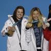 Women's halfpipe medalists from right, China's Liu Jiayu silver, United States' Chloe Kim, gold, and United States' Arielle Gold, bronze, pose during their medals ceremony at the 2018 Winter Olympics.